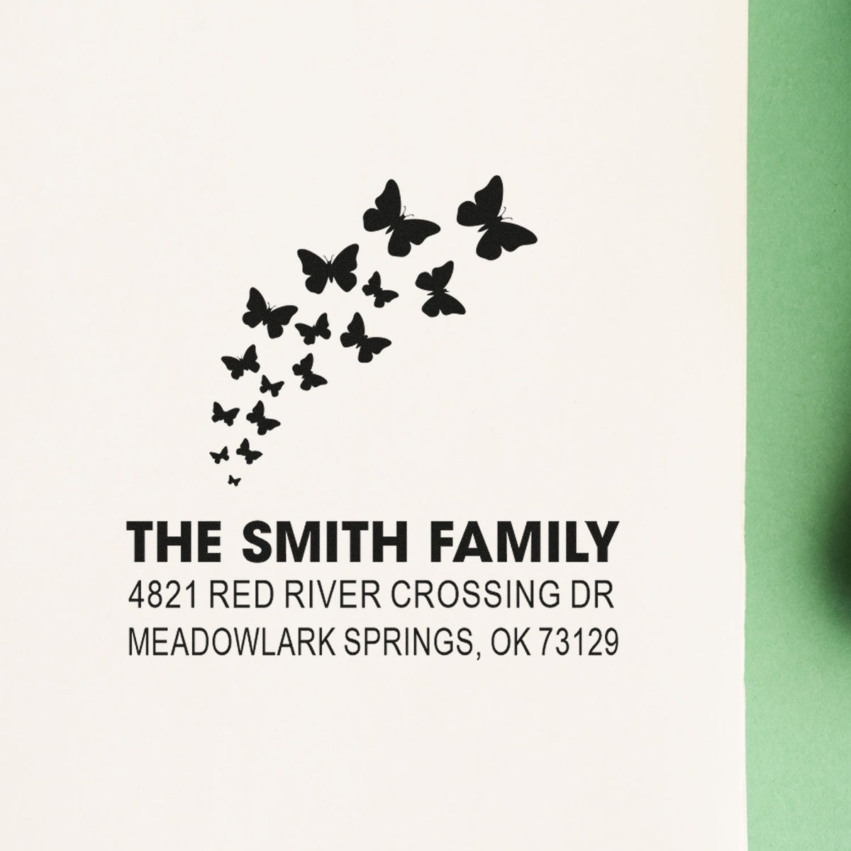 Custom rubber stamp with butterfly design, The Smith Family name and address, featuring Meadowlark Springs, OK for personalized return mail.