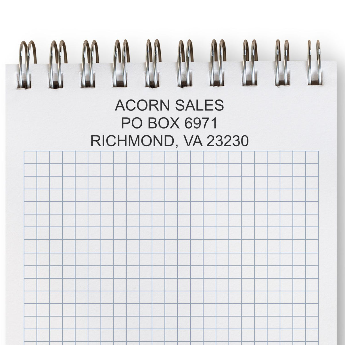 Spiral-bound graph paper notebook with Acorn Sales mailing address in Richmond, VA.