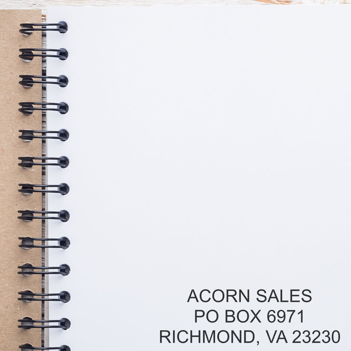 Blank spiral notebook page with Acorn Sales mailing address in Richmond, VA 23230.