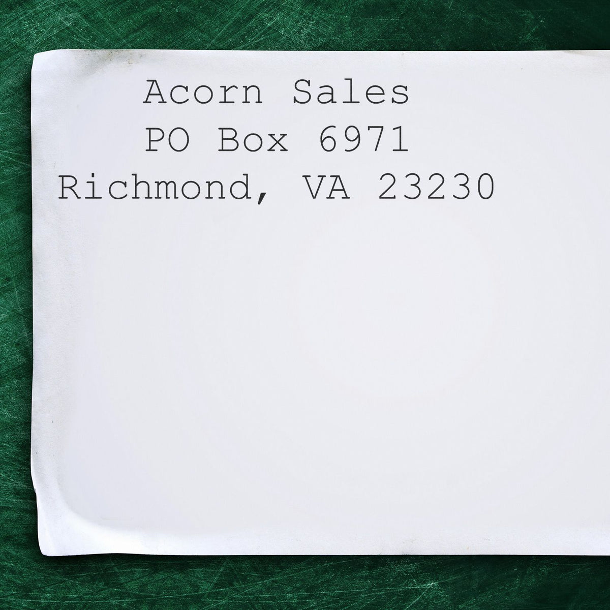 White envelope addressed to Acorn Sales, PO Box 6971, Richmond, VA 23230 on a green background.