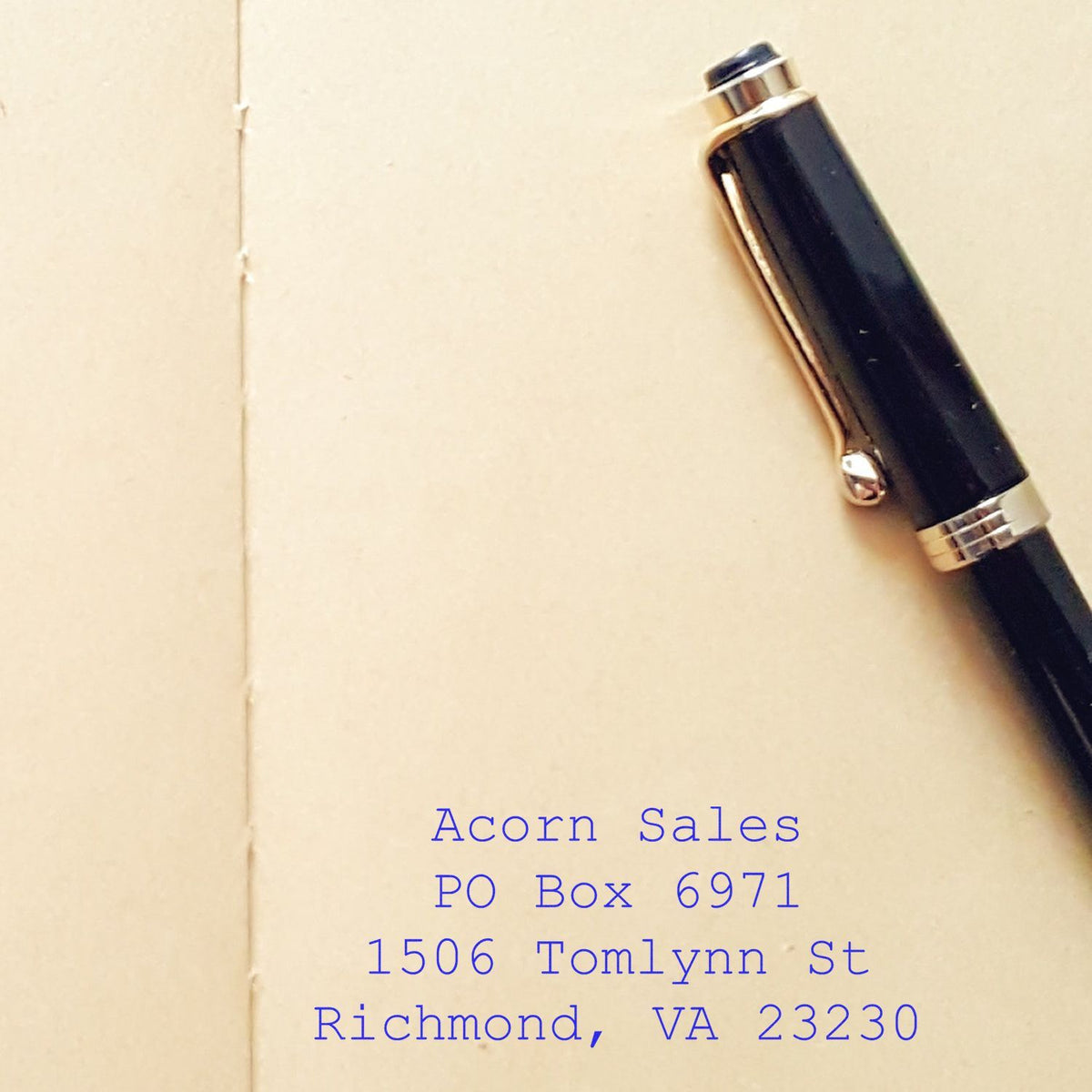 Black and silver fountain pen on cream paper with Acorn Sales Richmond VA address.