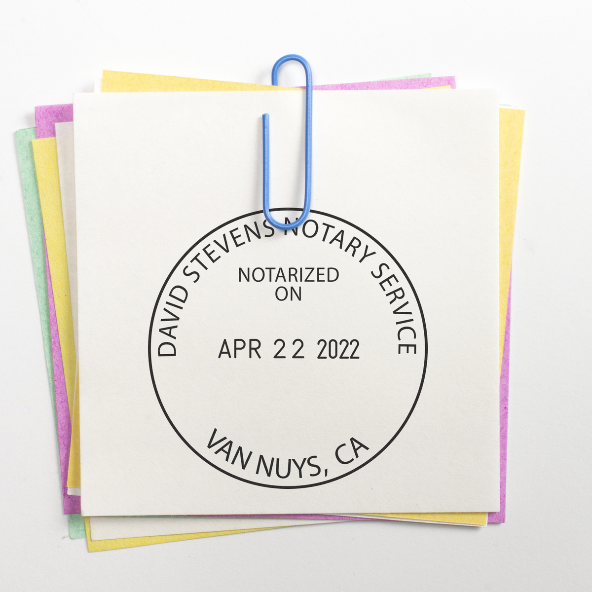 Stack of notary documents clipped together with a David Stevens Notary Service stamp, Van Nuys, CA.