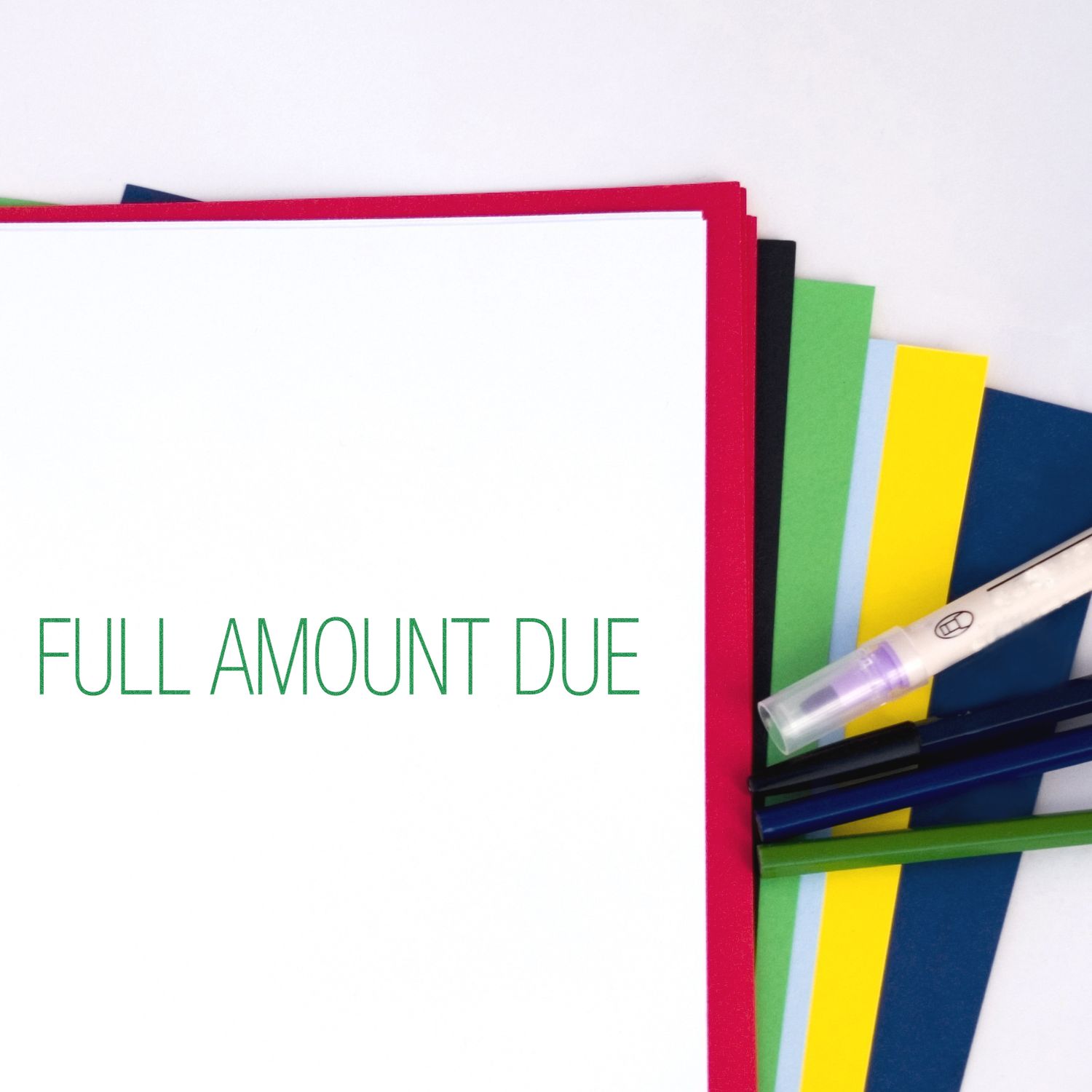 Full amount due notice with colorful folders and marker, suggesting outstanding invoice payment reminder for accounts receivable.