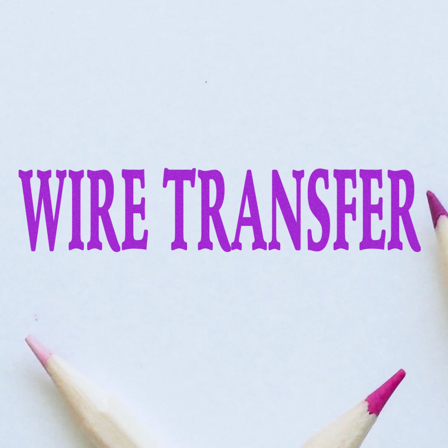 Purple WRITE TRANSFER lettering on white paper with colored pencils, illustrating a creative writing transfer concept.