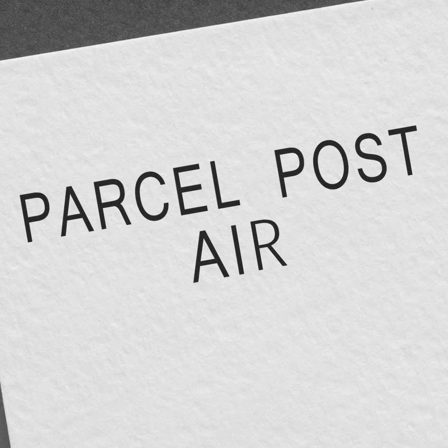 Parcel Post Air shipping label text on textured background, highlighting air mail service for sending packages.
