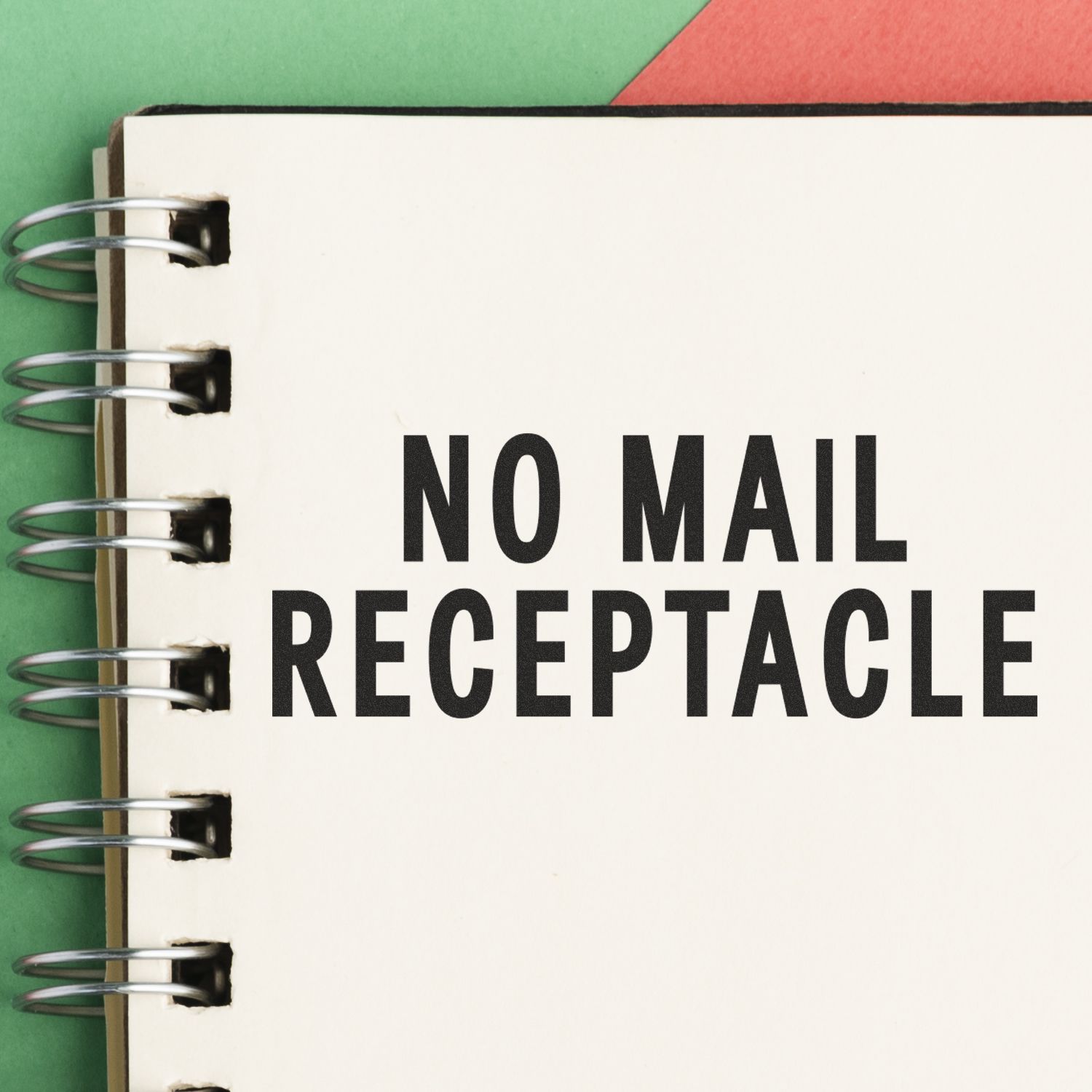 Close-up of a notebook-style sign reading No Mail Receptacle, indicating mail should not be placed for postal delivery.