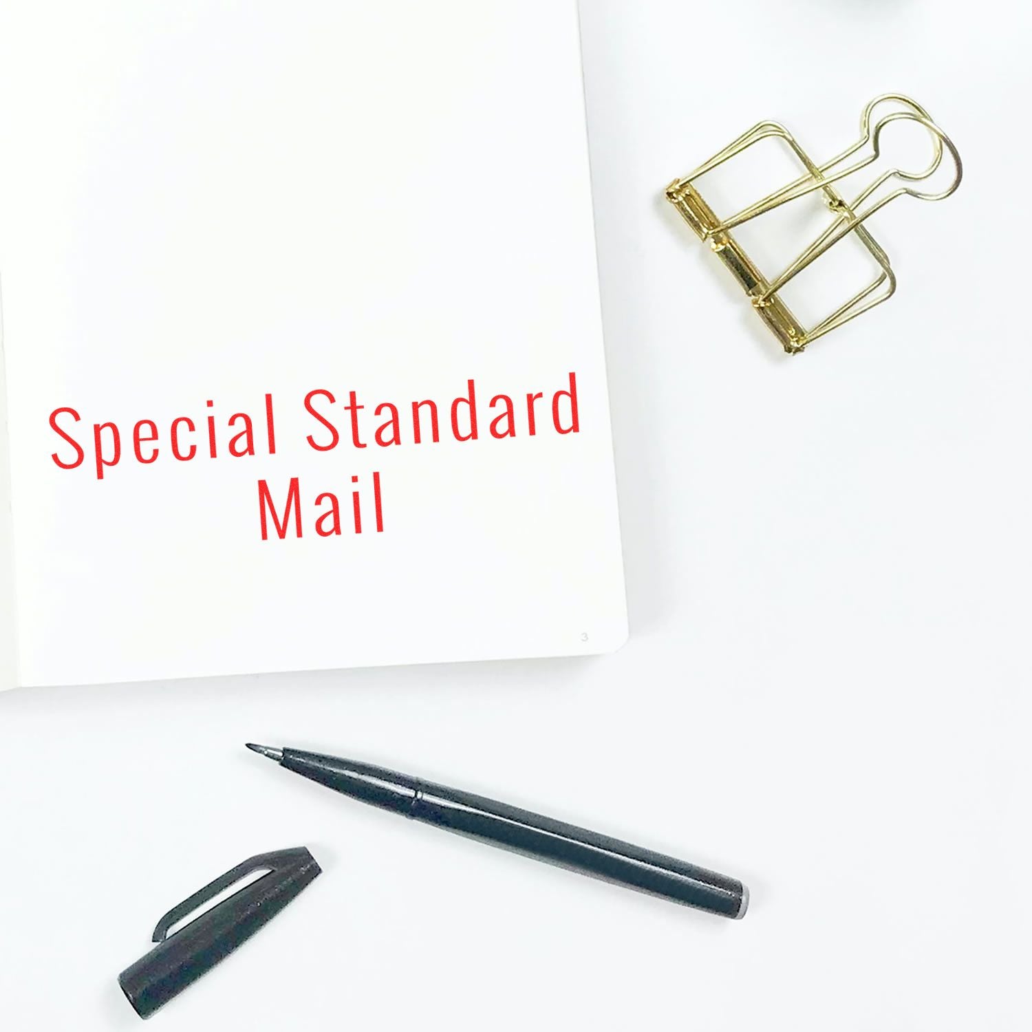 Special Standard Mail promotional stationery with paperclip and pen on white background for direct mail marketing campaign label design.