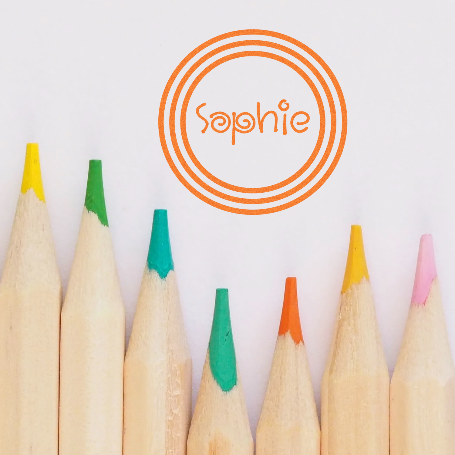 Custom rubber stamp logo for Sophie with colorful pencil tips, ideal for creative stationery branding.