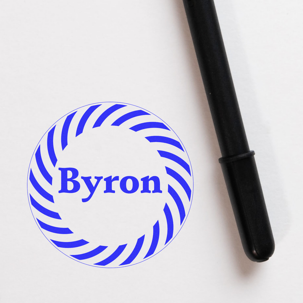 Byron logo in a blue striped circle with a black pen on white background, representing brand identity and local marketing strategy.