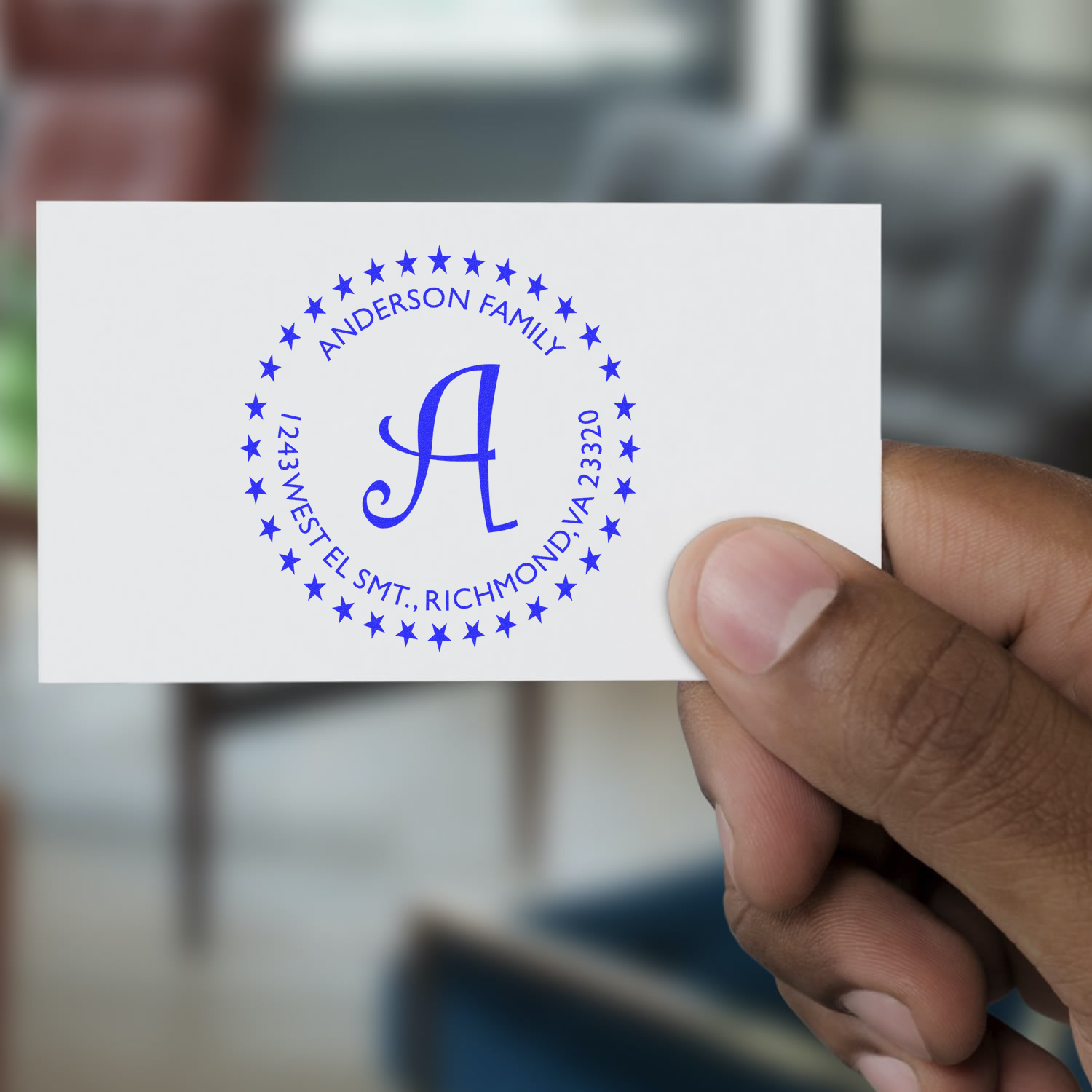 Custom return address rubber stamp with Anderson Family monogram A and star border, shown on a sample card.