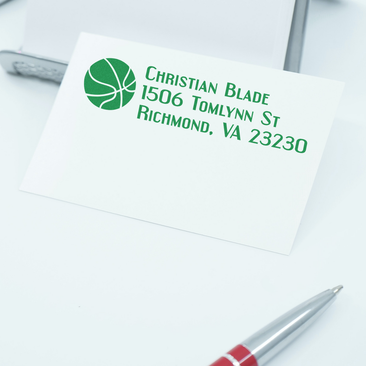 Custom address rubber stamp for Christian Blade, 1506 Tomlynn St, Richmond, VA 23230, on white stationery.