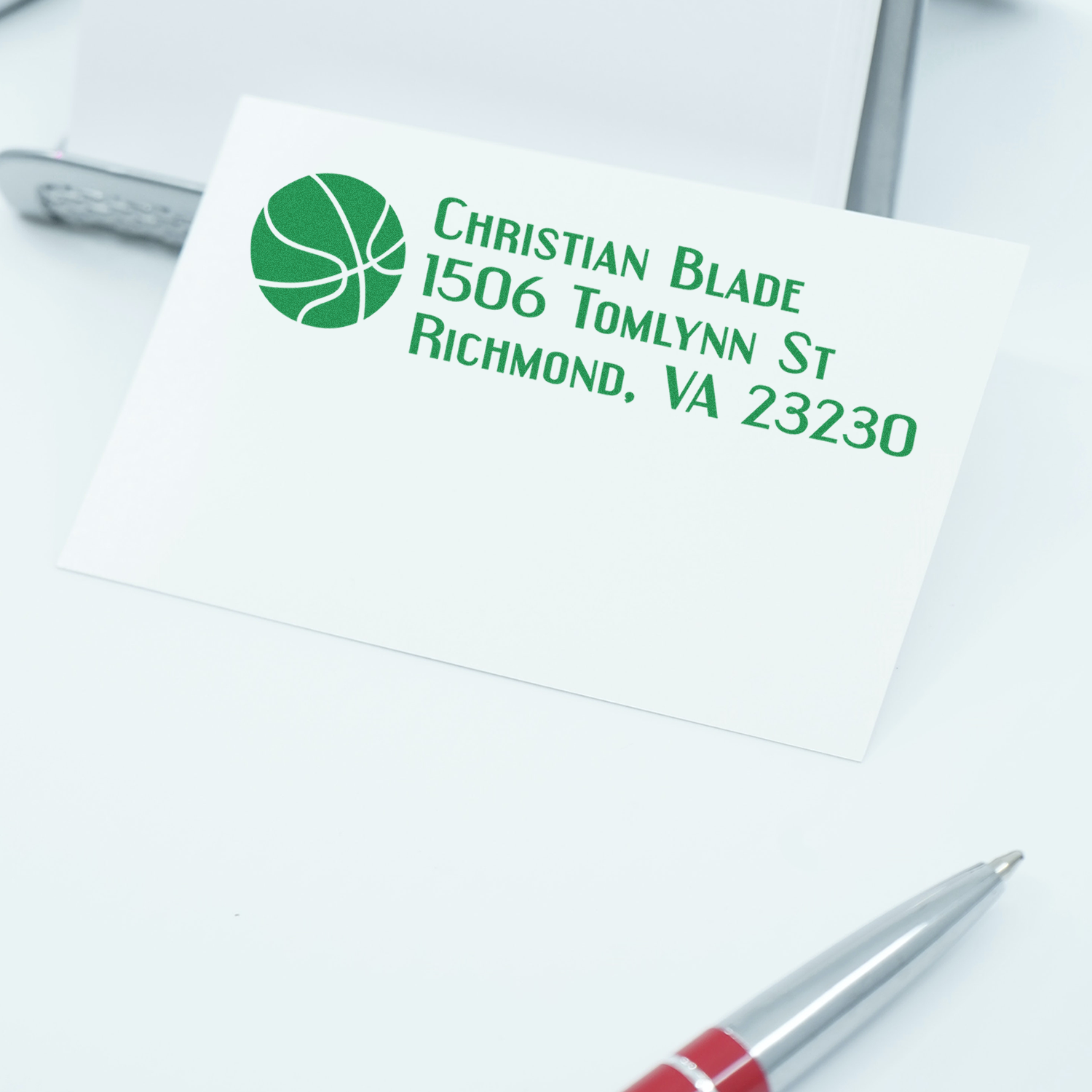 Custom rubber return address stamp with logo for Christian Blade, Richmond, VA 23230