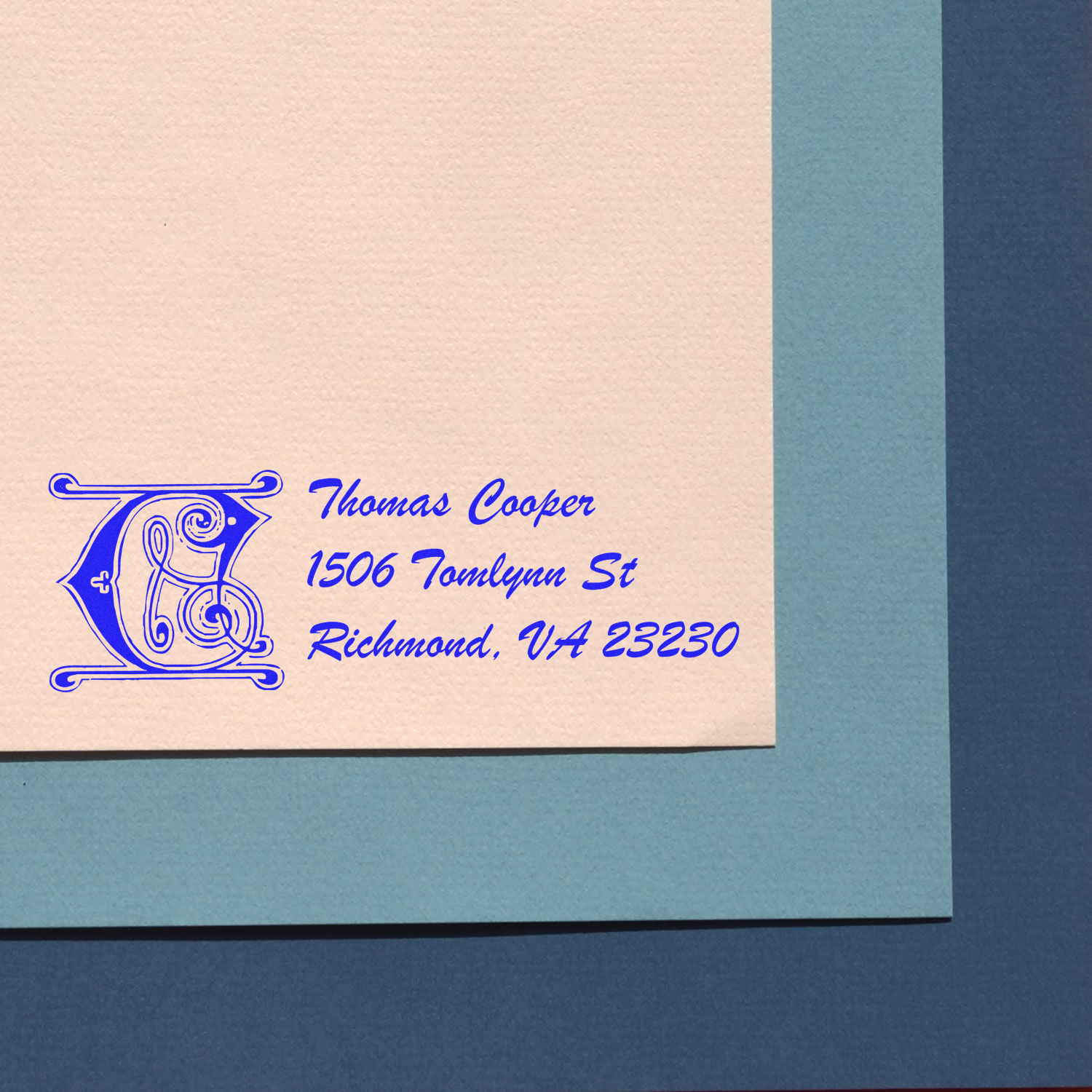 Personalized rubber return address stamp with monogram C for Thomas Cooper, Richmond, VA 23230, in blue ink.