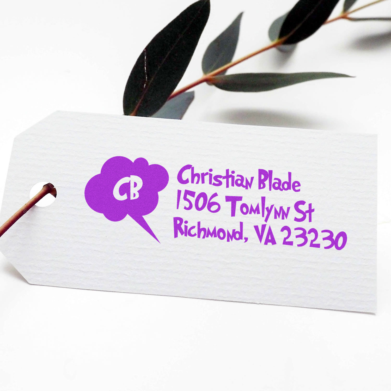 Custom return address rubber stamp in purple ink on an envelope, reading Christian Blade, 1506 Tomlynn St, Richmond, VA 23230.