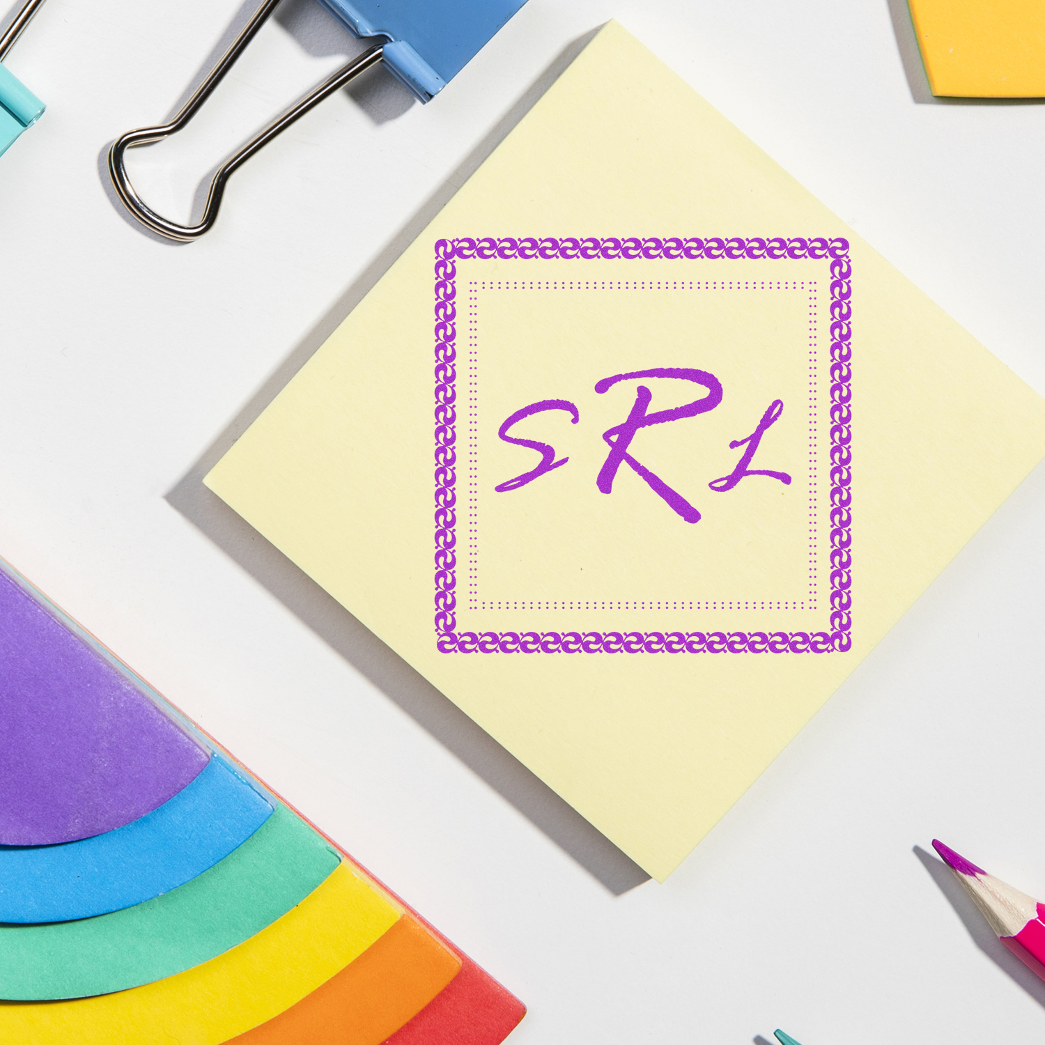 Custom rubber stamp design on sticky note with decorative border, ideal for branded office stationery and personalized packaging.