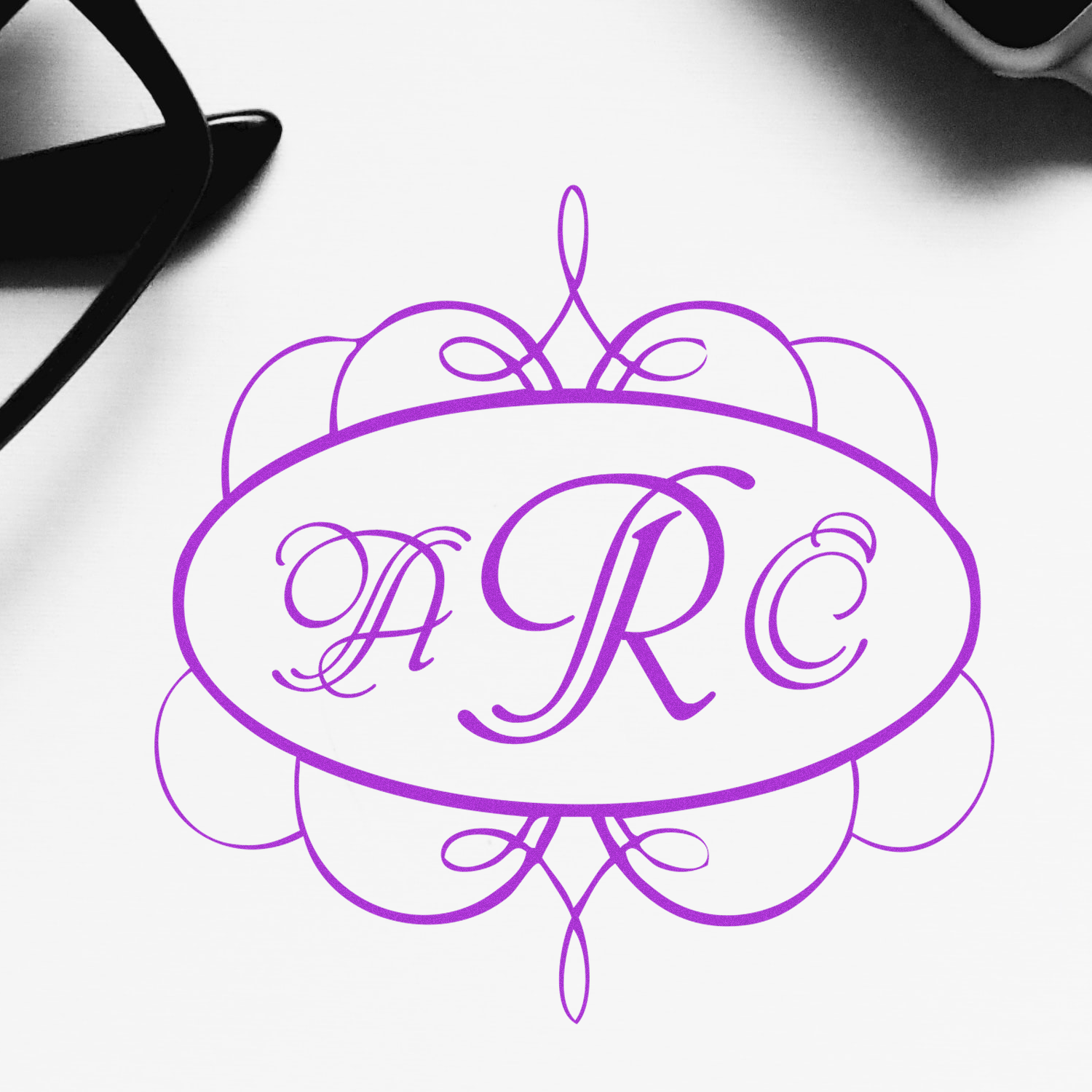 Custom ARC monogram rubber stamp with ornate floral frame for wedding invitations and personalized branding.