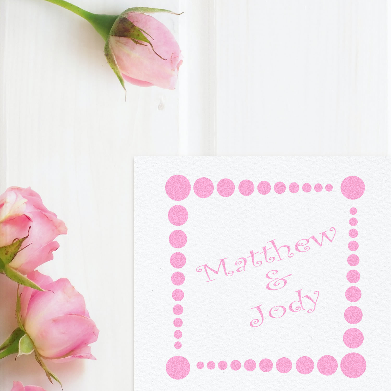 Custom wedding rubber stamp with pink rose buds and dotted frame, featuring Matthew & Jody for personalized stationery and invitations.
