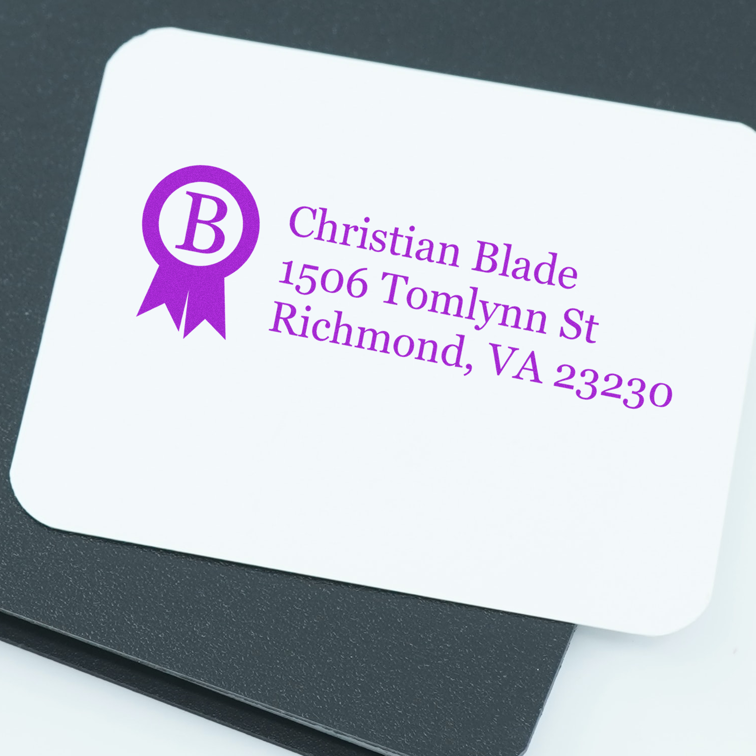 Custom business address rubber stamp with logo and return address for Christian Blade, Richmond, VA 23230.