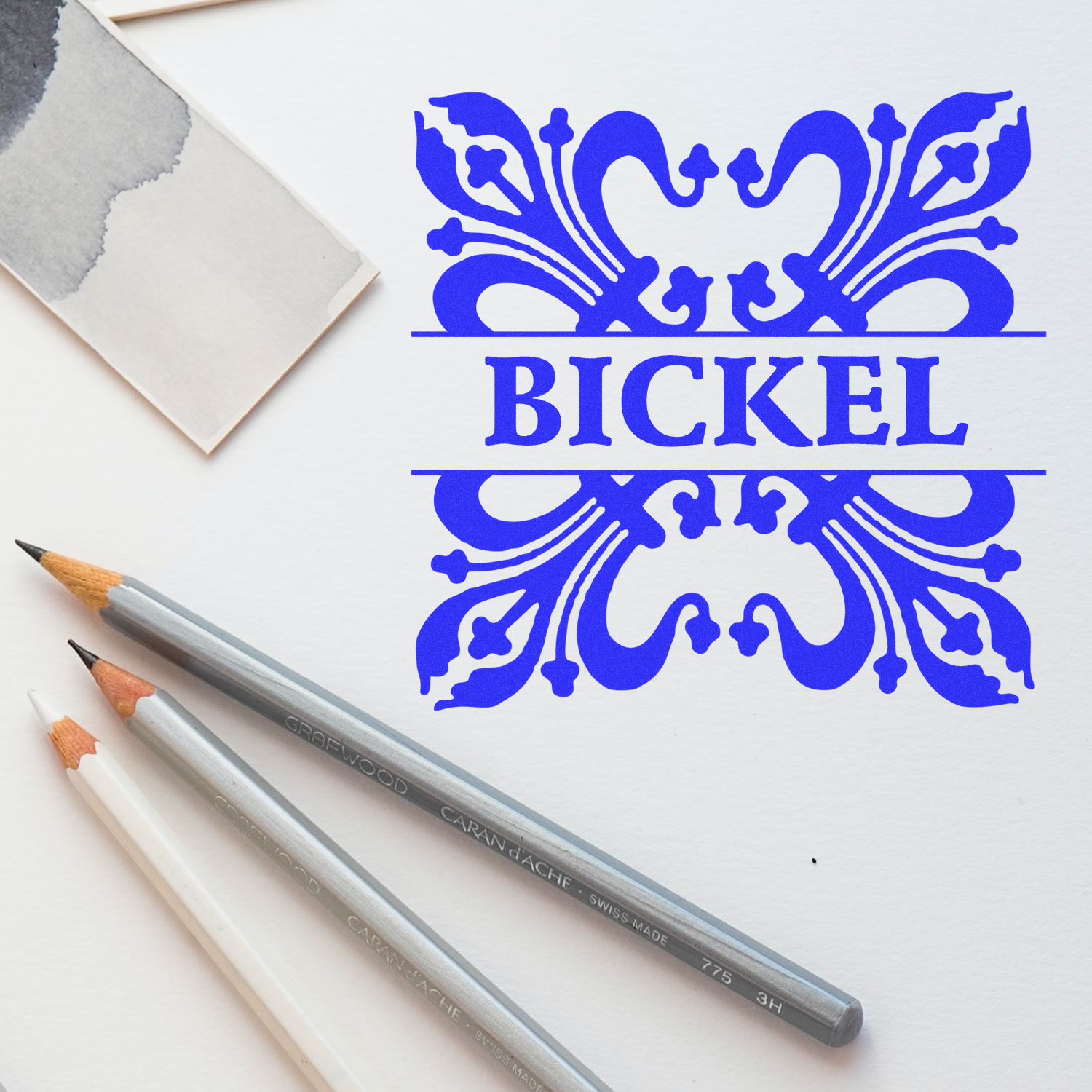 Custom rubber stamp design featuring ornate BICKEL monogram for stationery, branding, and paper crafts.