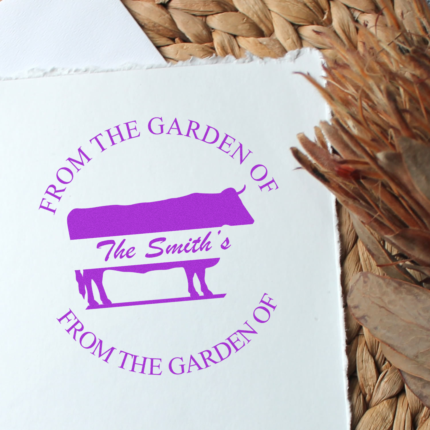 Personalized rubber stamp design in purple ink reading From the Garden of The Smiths with a bench graphic on white paper.