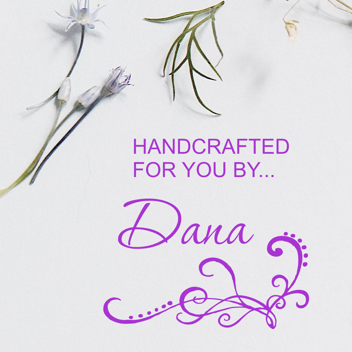 Custom rubber stamp design with floral accents and Handcrafted for You by Dana text in purple ink.