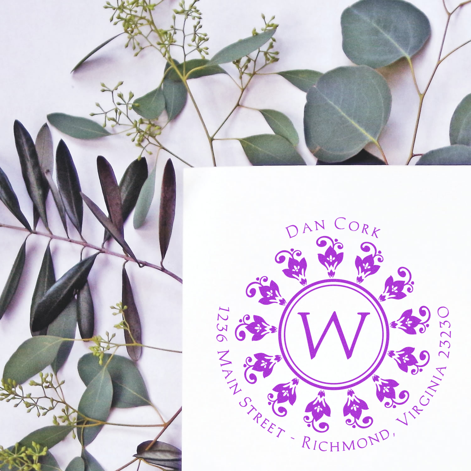 Custom floral monogram rubber stamp with letter W and Virginia address for elegant wedding stationery and branding.