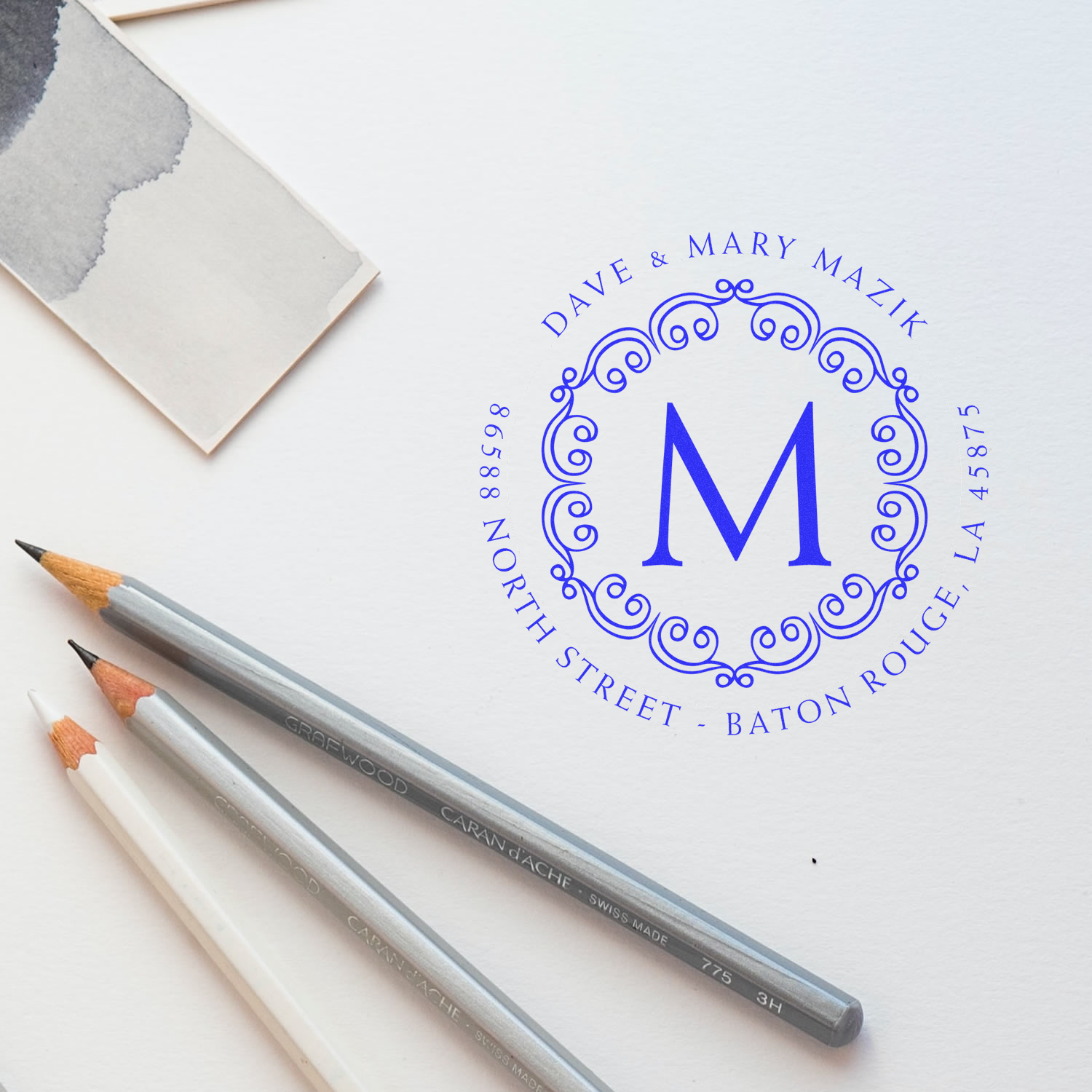 Custom address rubber stamp with monogram M, Dave & Mary Mazik, for personalized wedding stationery.