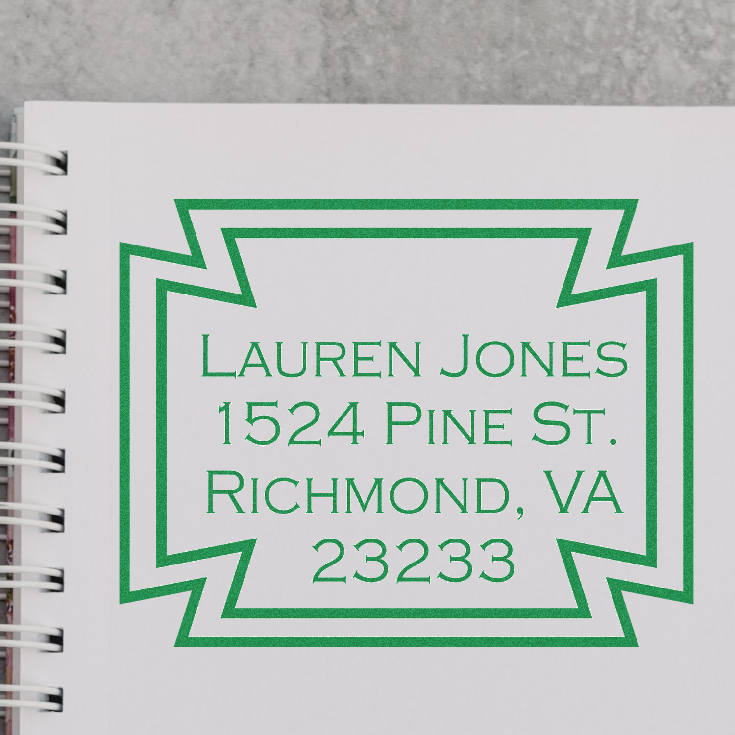 Custom return address rubber stamp for Lauren Jones, Richmond, VA 23233 with bold geometric border.