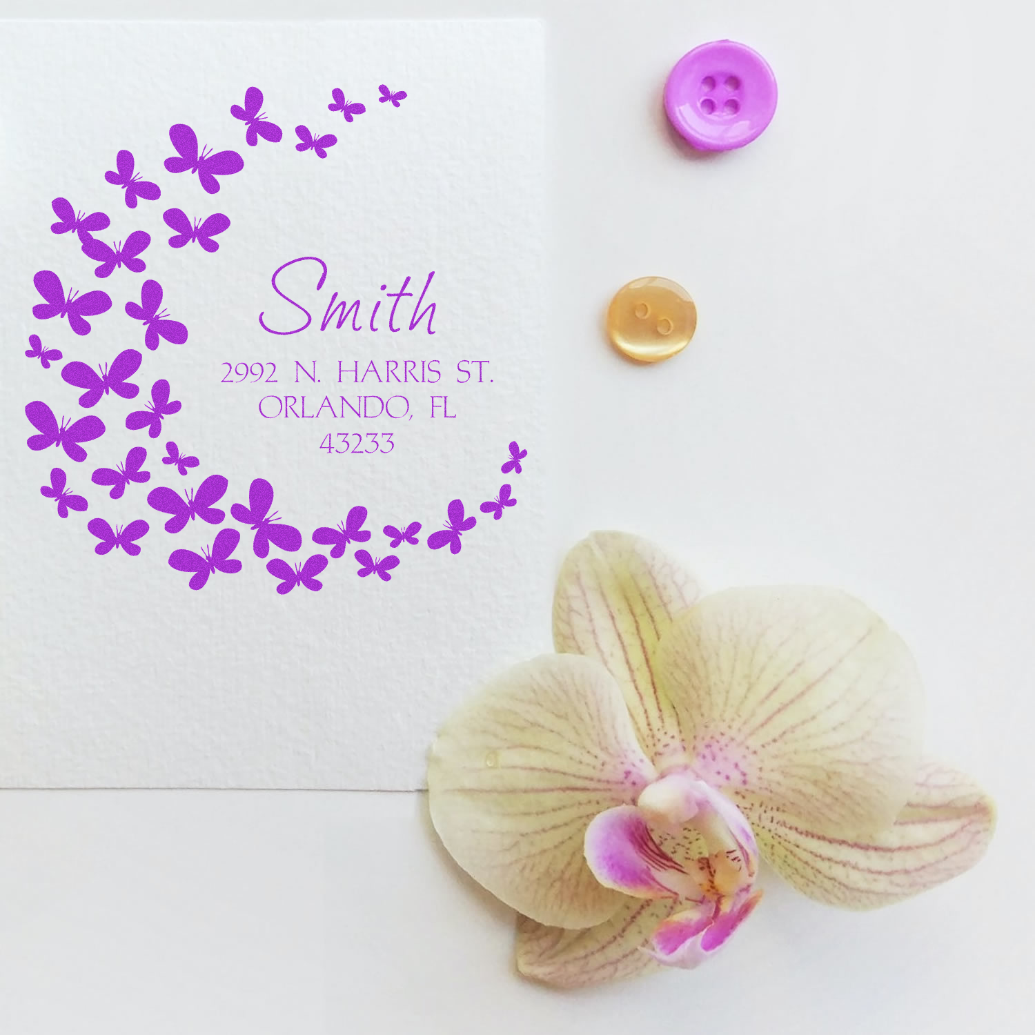 Custom butterfly return address rubber stamp sample with Smith address, designed for envelope branding and wedding stationery.