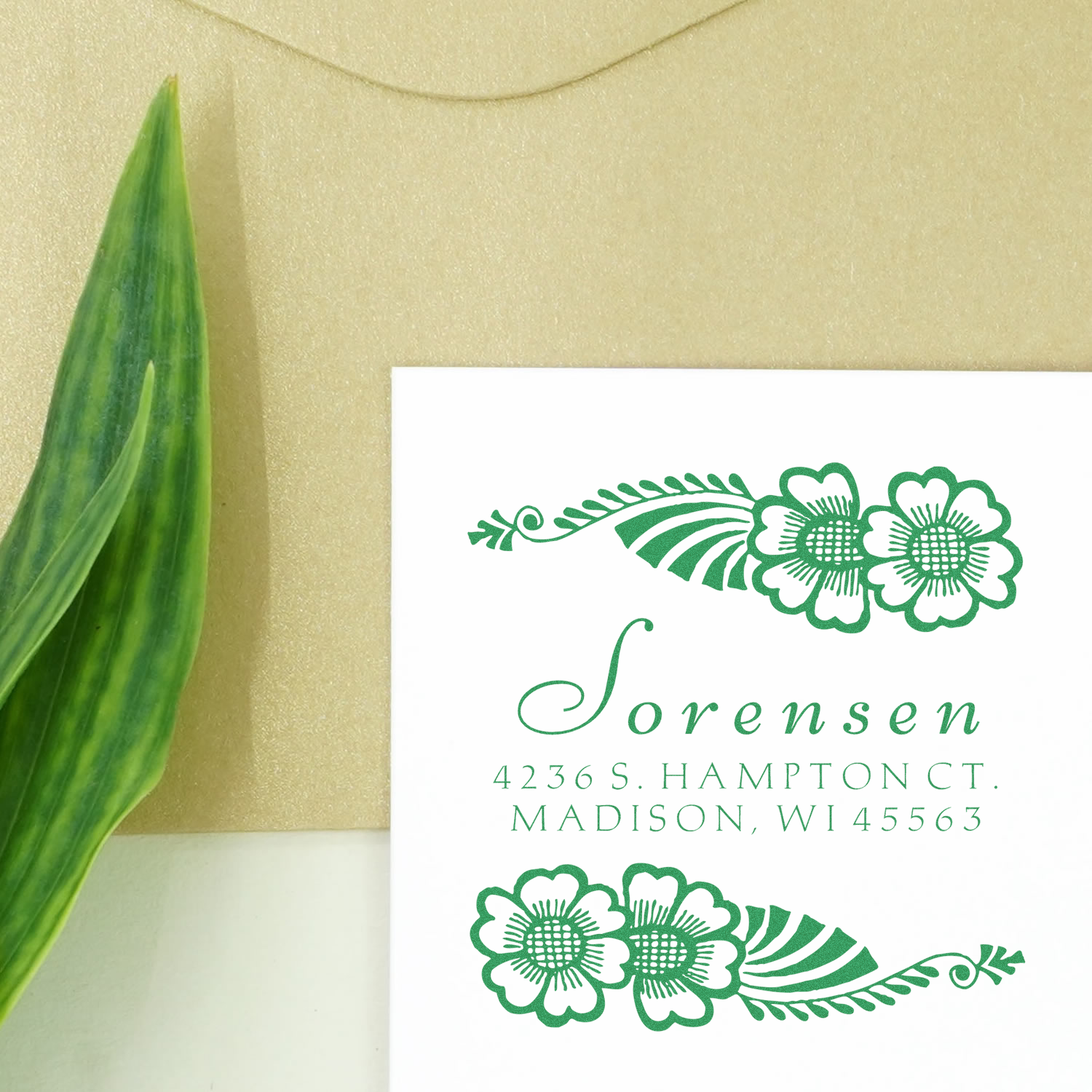 Custom floral return address rubber stamp with green botanical design for wedding invitations and envelopes.