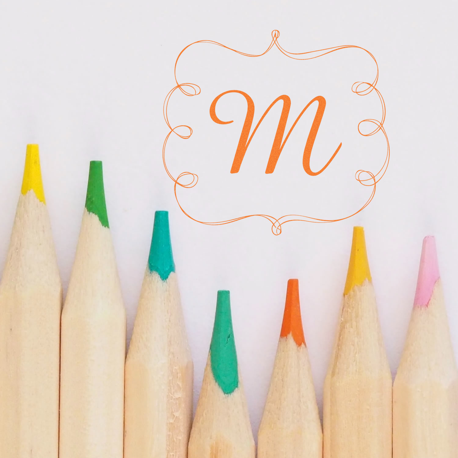Custom monogram M rubber stamp design with ornate border, ideal for personalized stationery, crafts, and branding.