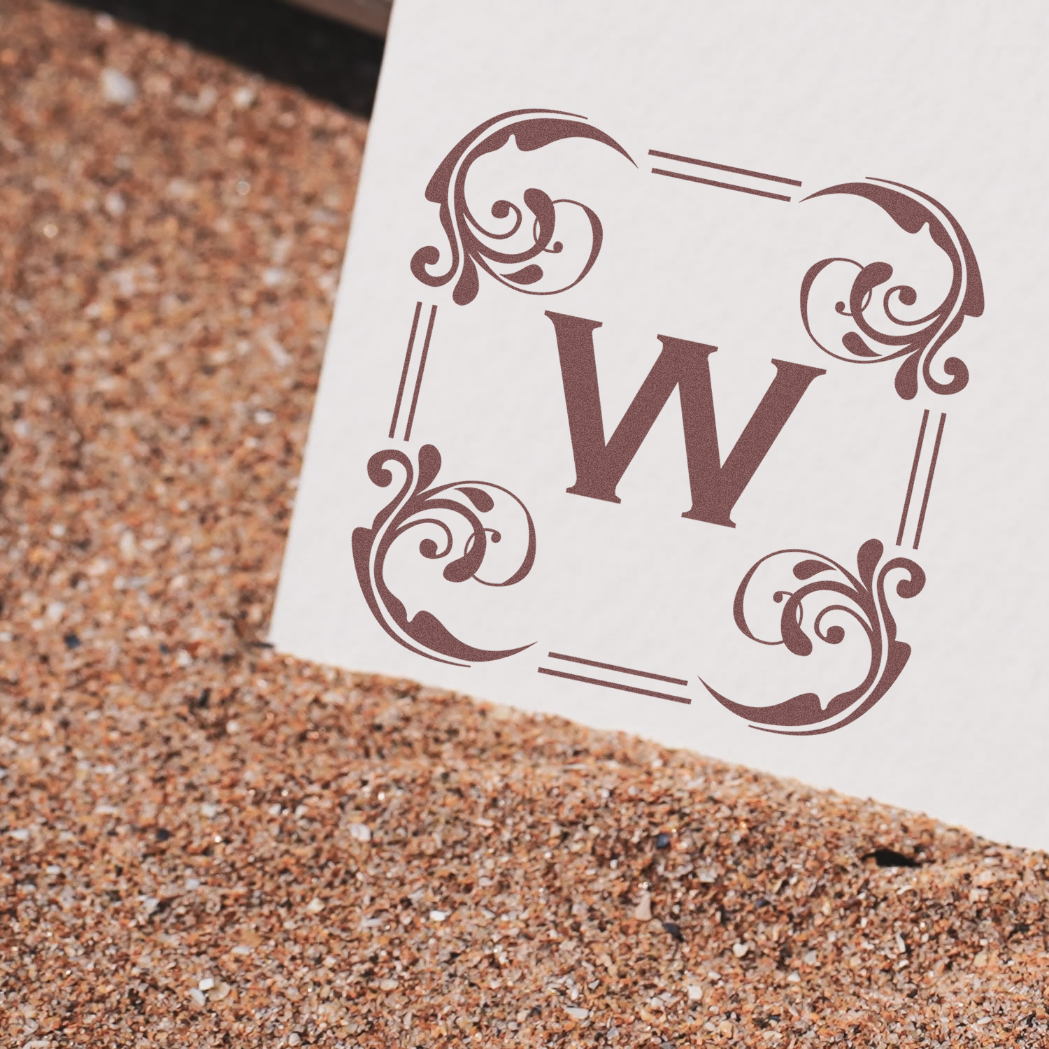 Custom decorative W monogram rubber stamp design with ornate border, ideal for personalized stationery and branding.