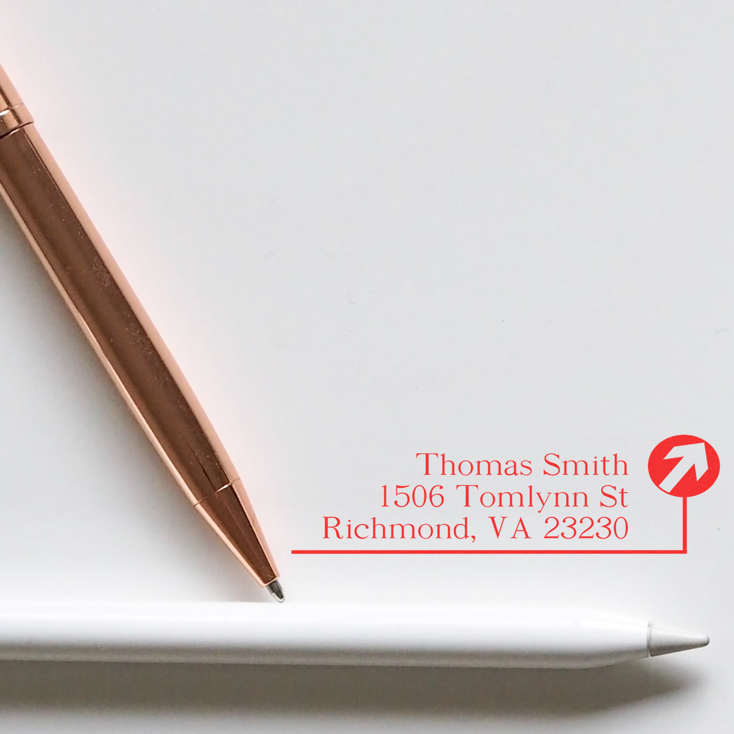 Custom return address rubber stamp for Thomas Smith, Richmond VA 23230, with pen and stylus.