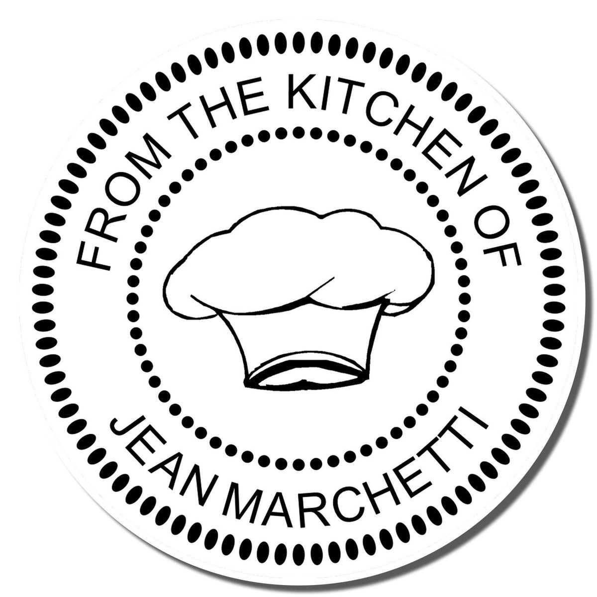 Custom rubber stamp for homemade baking, reading From the Kitchen of Jean Marchetti with chef hat design.