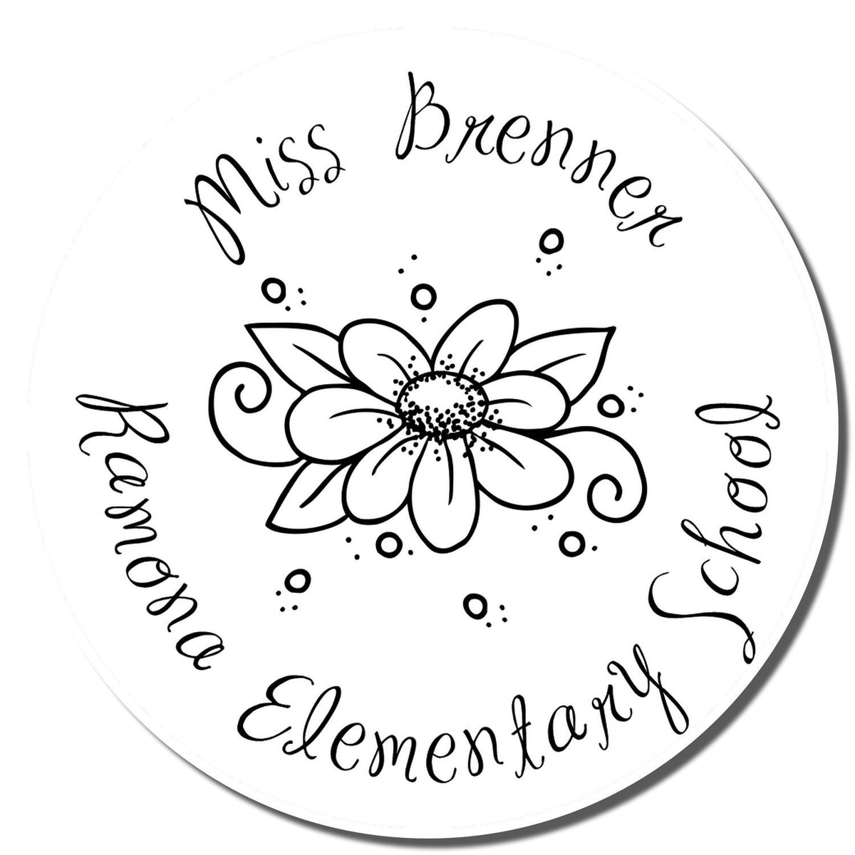 Custom floral rubber stamp design for Miss Brenner Elementary School, featuring circular text and a flower centerpiece.