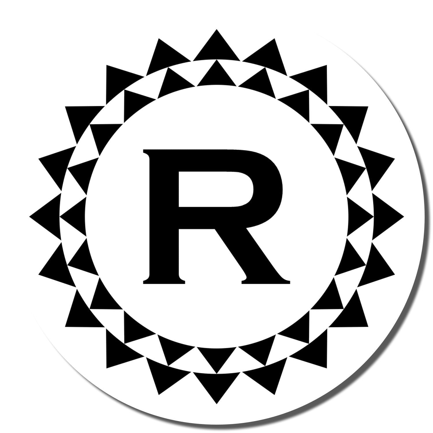Custom rubber stamp with bold letter R in a circular sunburst triangle border, ideal for monogram branding.