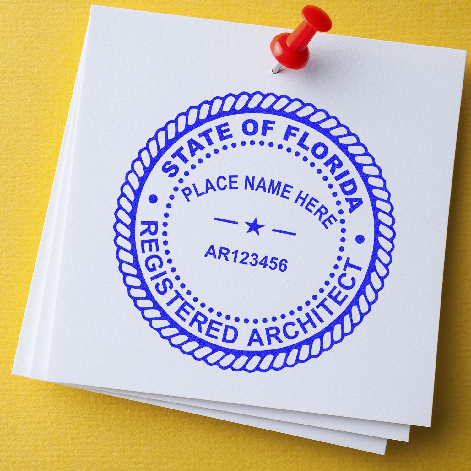 Florida registered architect seal stamp on white paper with red pushpin on yellow background, blueprint-style business document.