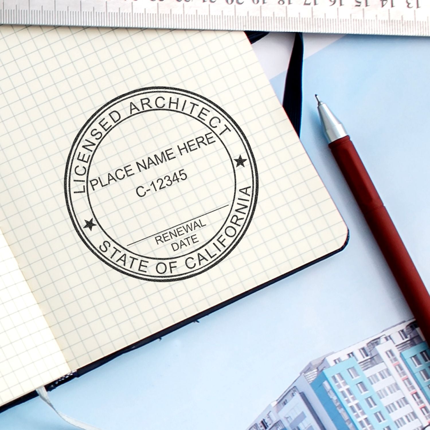 Licensed architect stamp on graph paper notebook with pen, ruler, and architectural blueprint, California architecture license concept.