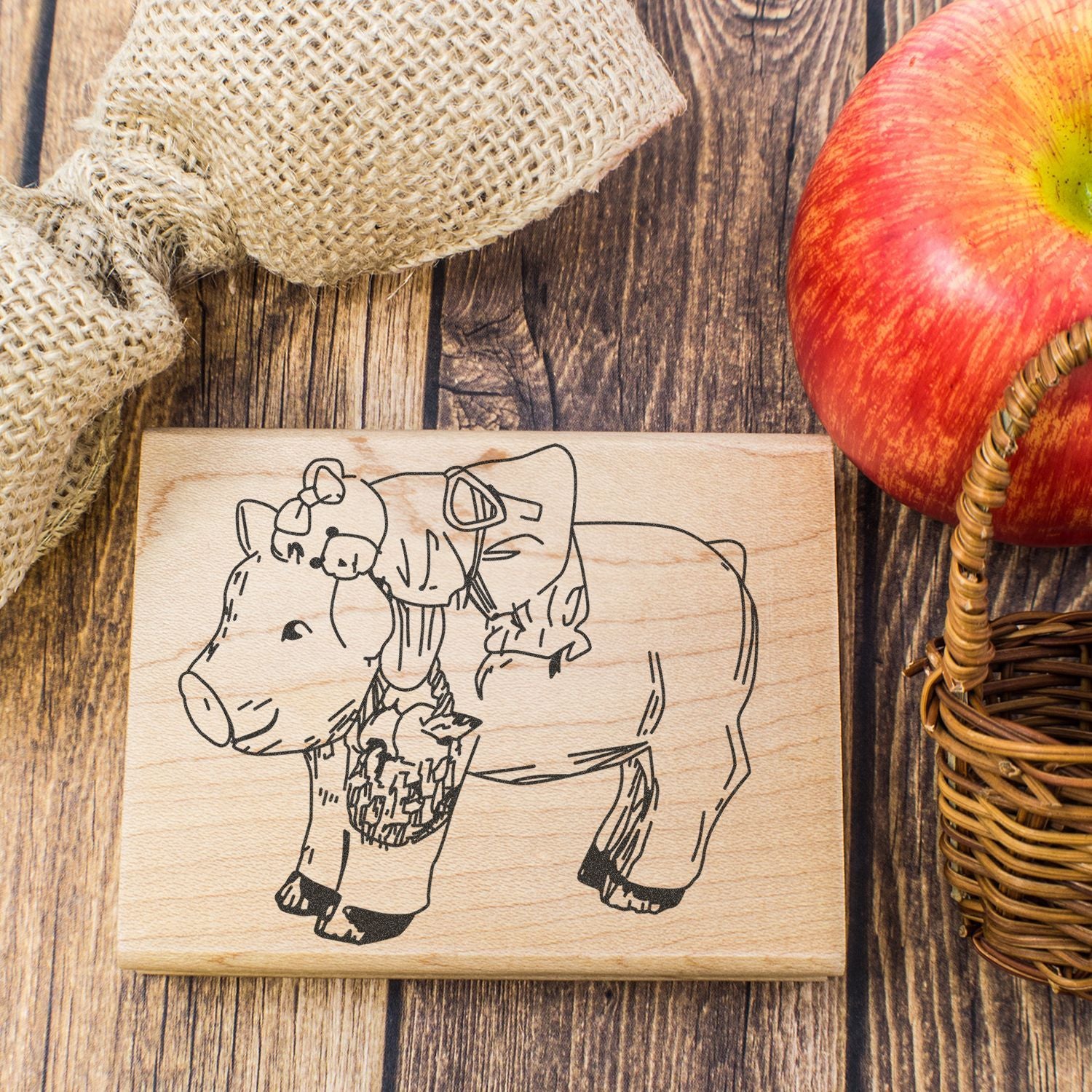 Rustic wooden pig and piglet sign with farm animal line art, perfect country kitchen decor.