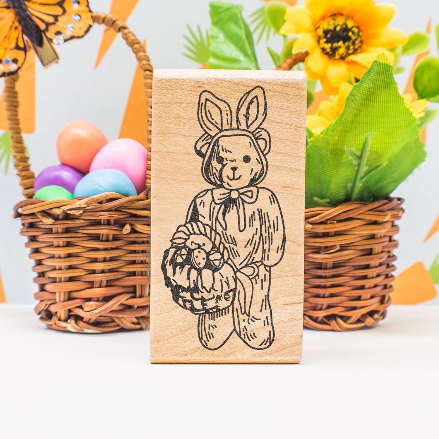Easter bunny wooden stamp with basket of eggs, colorful spring dcor, and flower basket background
