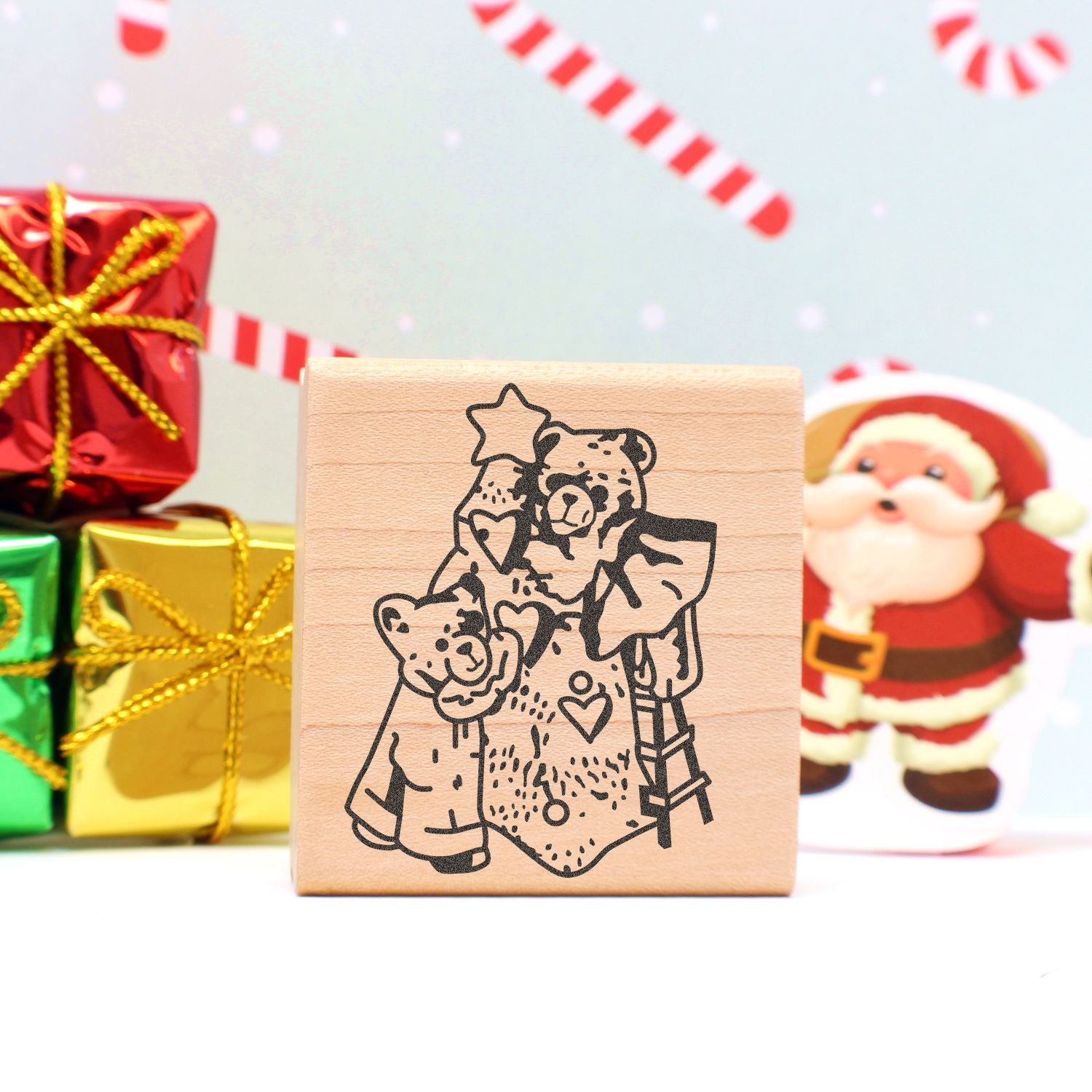 Wooden Christmas stamp with teddy bears and stars, festive holiday gift craft design with wrapped presents and Santa background.