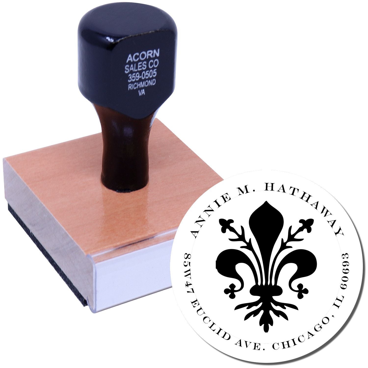Custom round rubber stamp with fleur-de-lis logo design for business address stamping on envelopes and stationery.