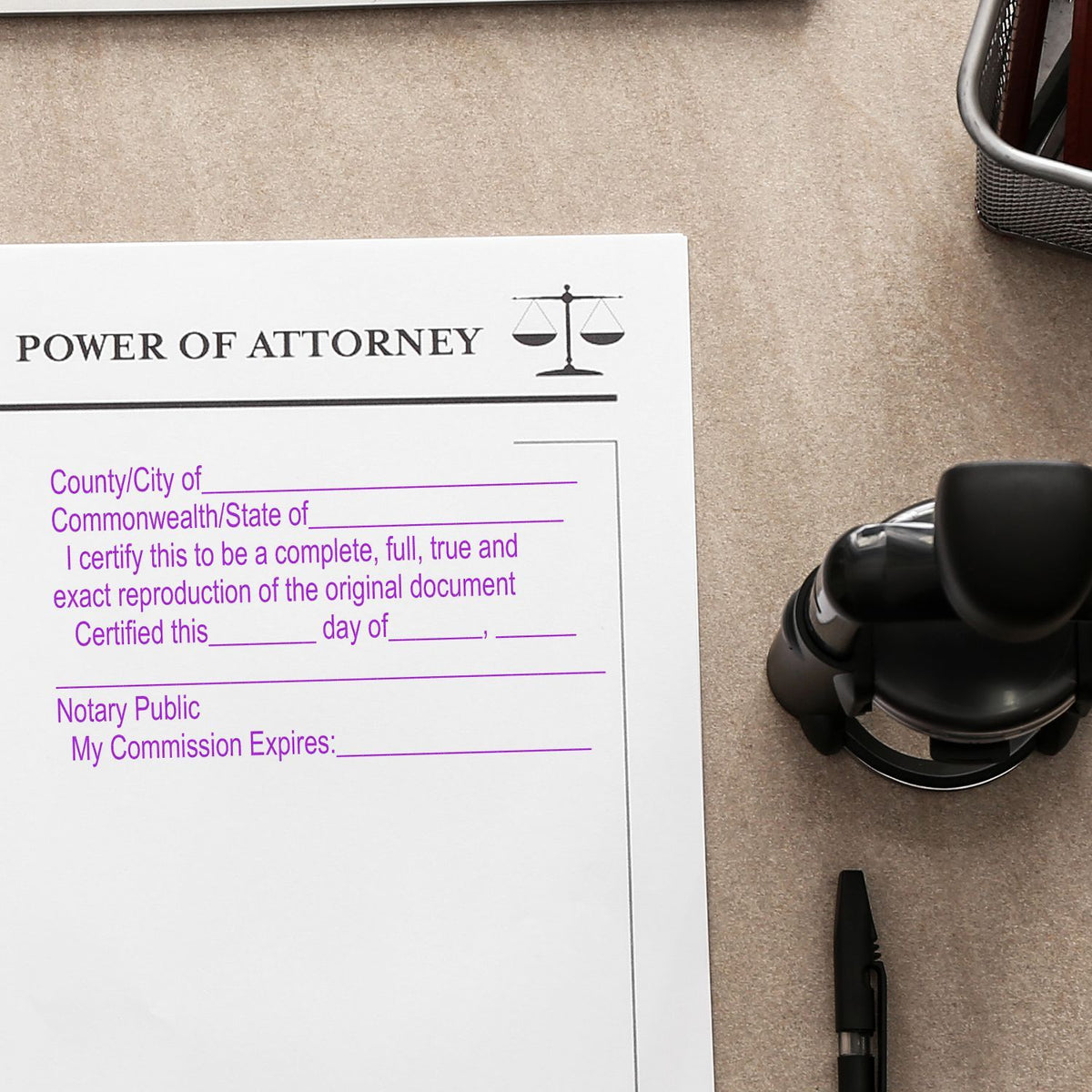 Power of attorney document with notary public certification form and stamp on office desk.