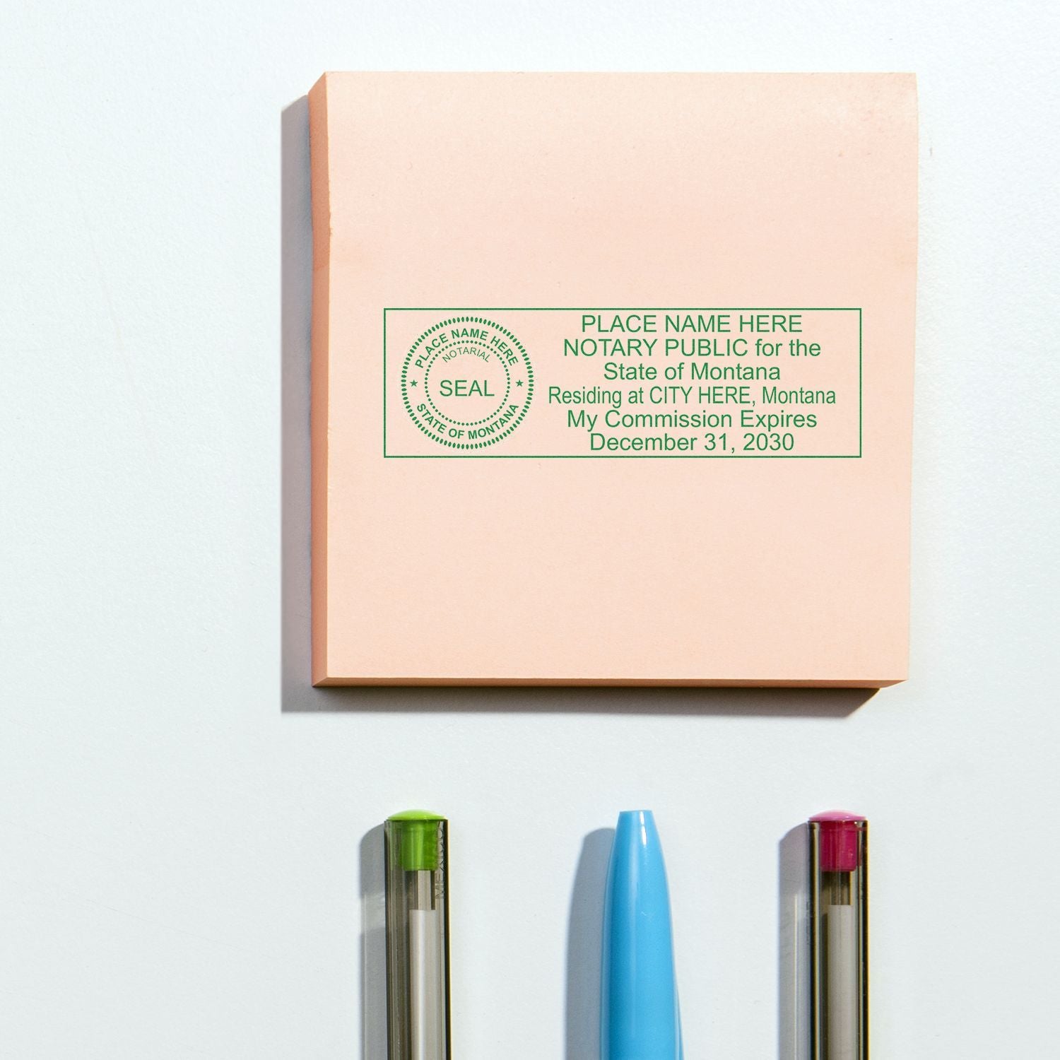 Montana notary public seal stamp with colorful pens on a clean white background