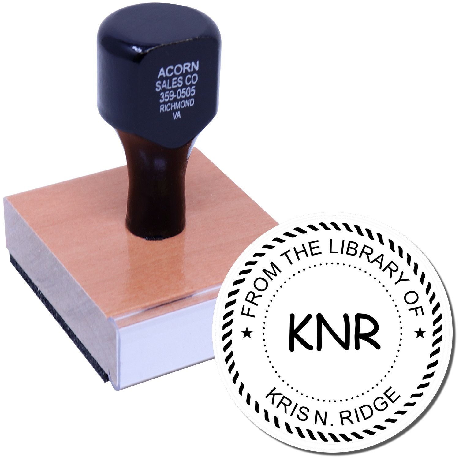 Custom library rubber stamp with wooden handle, showing personalized From the Library of KNR bookplate design.
