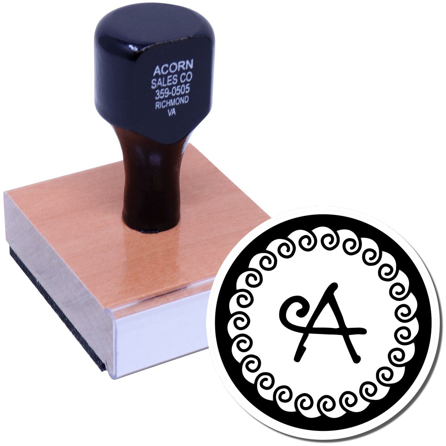 Custom rubber stamp with decorative monogram A design, shown on wooden stamp block for personalized business or craft use.