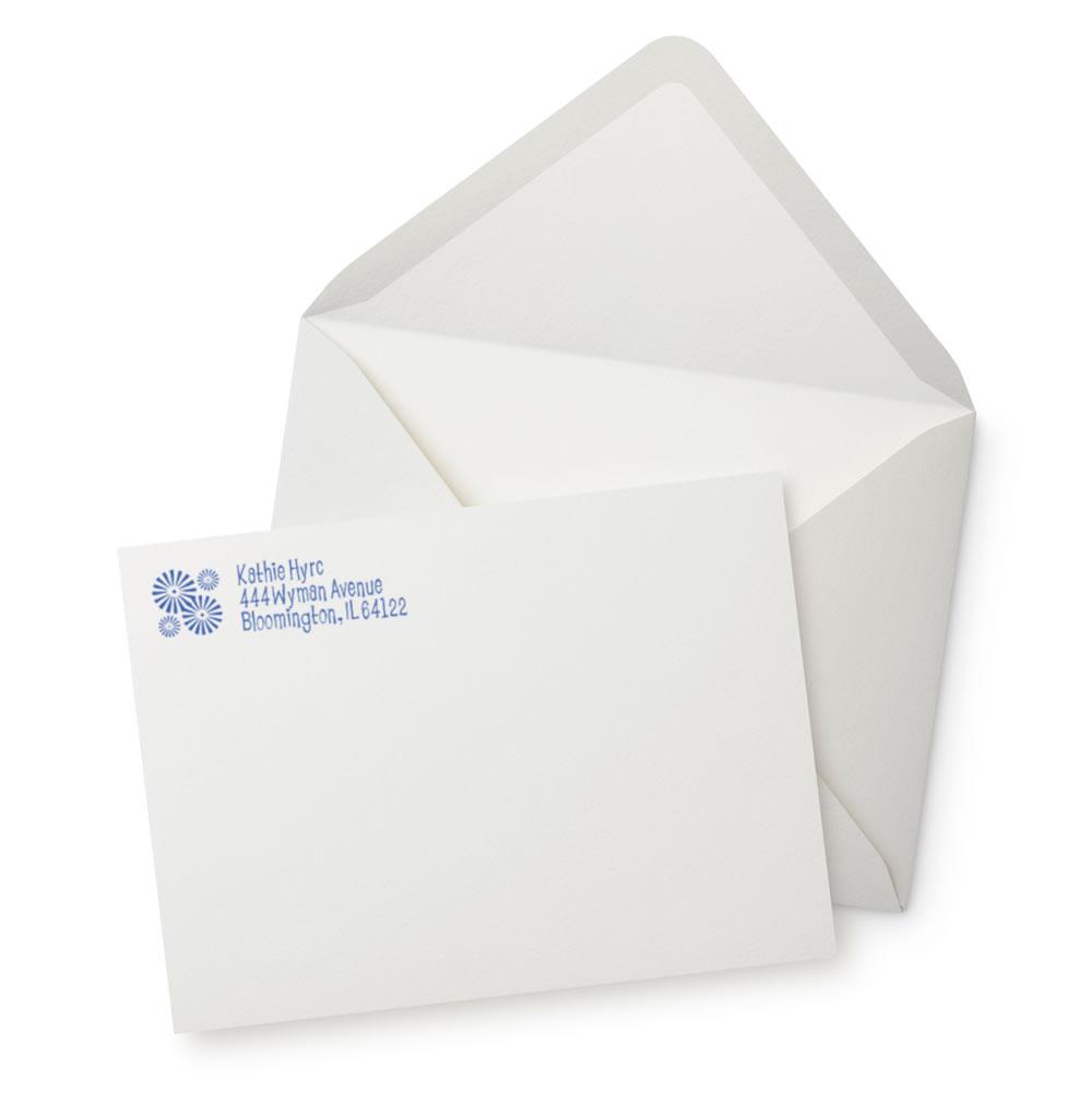 Custom return address rubber stamp on wedding envelope and card, ideal for personalized mail and stationery.