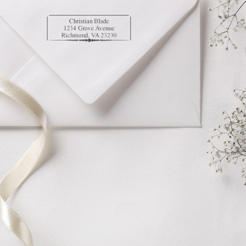 Personalized return address rubber stamp on envelope for wedding or business mail