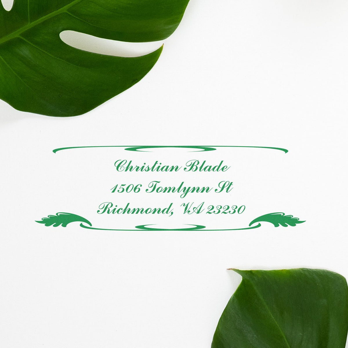 Custom return address rubber stamp with tropical leaves, featuring Christian Blade, Richmond, VA 23230.