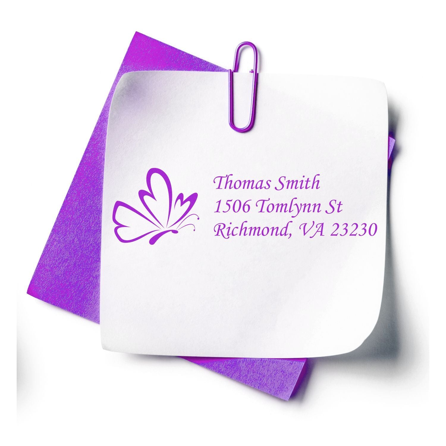 Custom butterfly return address rubber stamp mockup on white note paper with purple envelope, personalized for Thomas Smith.